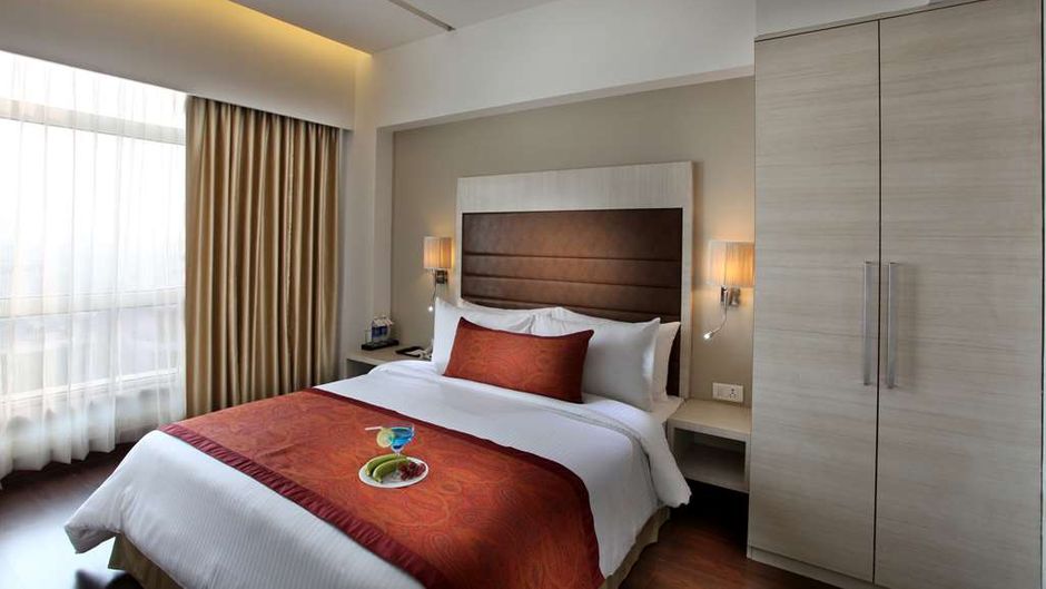 Mahagun Sarovar Portico Room