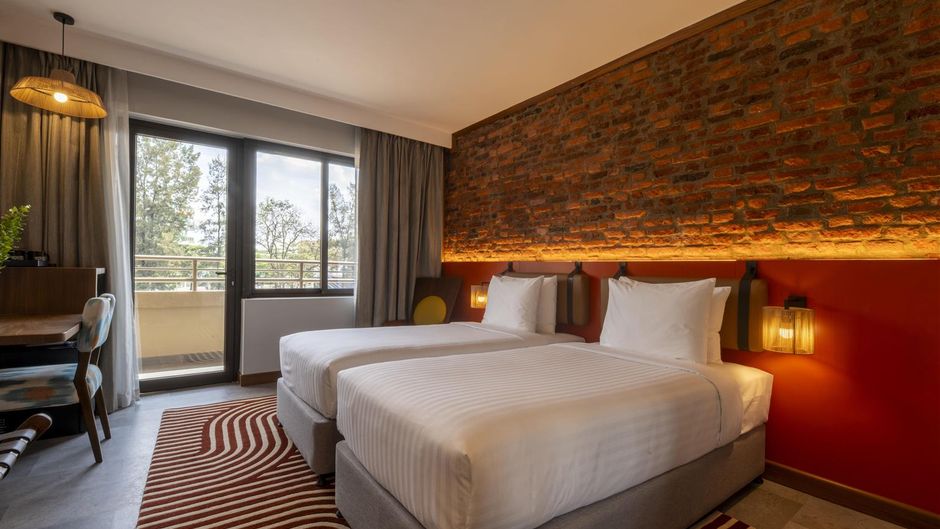 Zaria Court Hotel Hilton Room