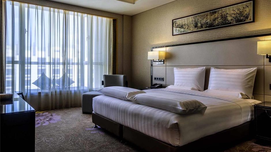 Pullman Qingdao Ziyue Hotel Room