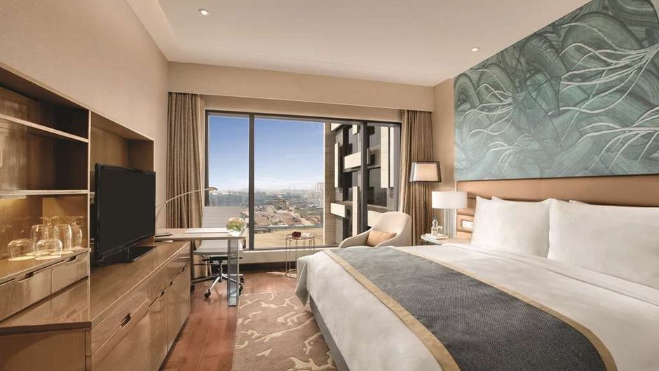 The Leela Ambience Convention Hotel Room