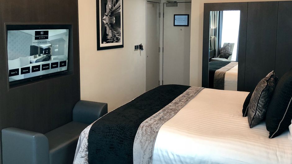 The Continental Hotel Room