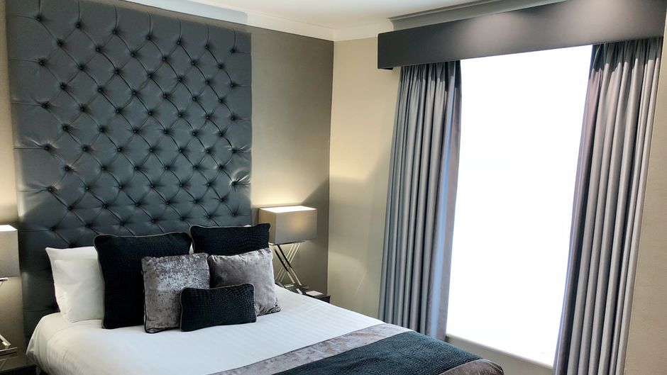The Continental Hotel Room