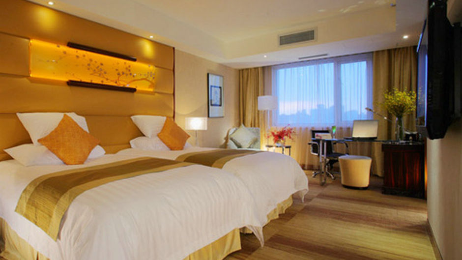 Gehua New Century Hotel Room