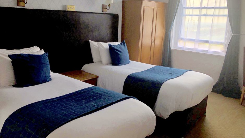 The Rising Sun Hotel Room