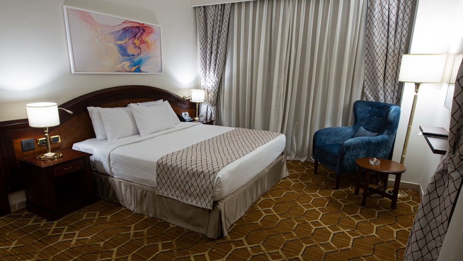 Triumph Plaza Hotel Room
