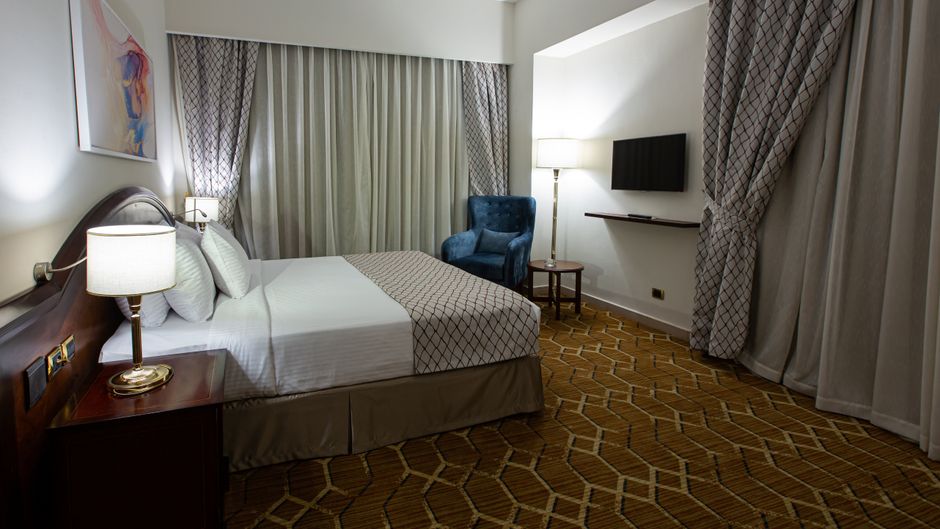 Triumph Plaza Hotel Room