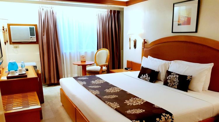 Palm Grove Hotel Room