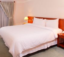 Windsor House Hotel by GEH Suites Room