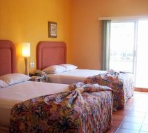 Hotel & Suites Las Palmas Room