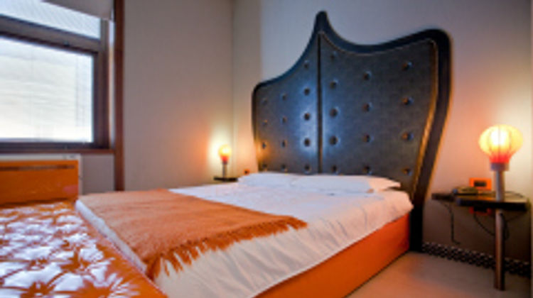 Orange Hotel Room