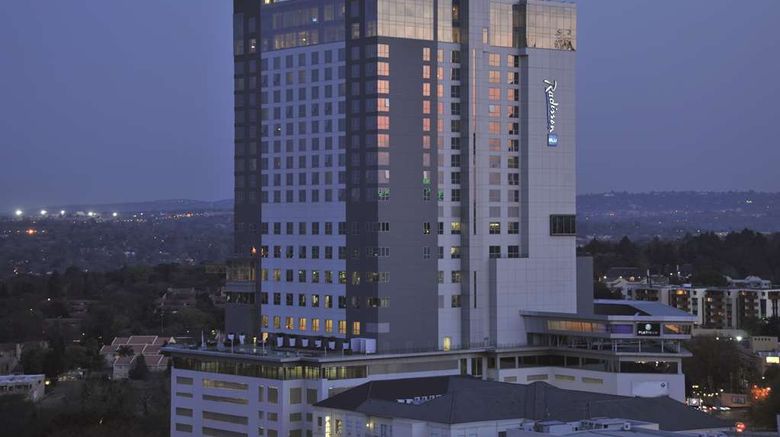 <b>Radisson Blu Hotel Sandton Exterior</b>. Images powered by <a href=https://www.travelagewest.com/Hotels/Sandton-South-Africa/