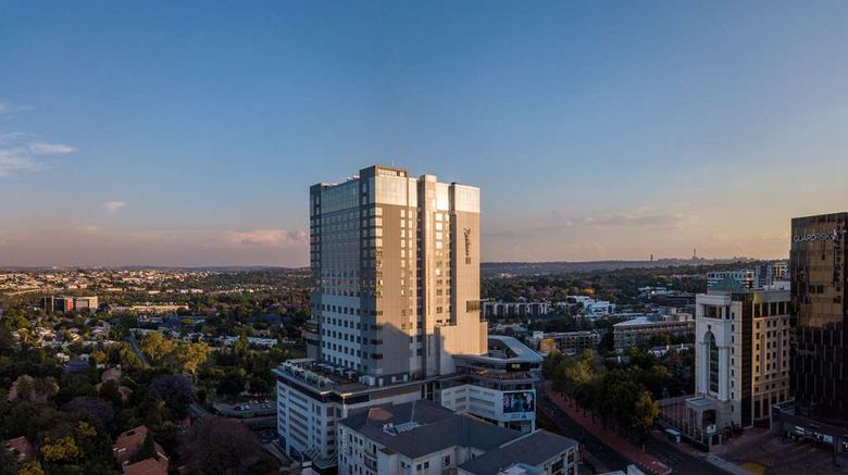 <b>Radisson Blu Hotel Sandton Exterior</b>. Images powered by <a href=https://www.travelagewest.com/Hotels/Sandton-South-Africa/