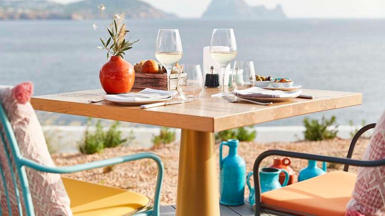 <b>7Pines Resort Ibiza Restaurant</b>. Images powered by <a href=https://www.travelagewest.com/Hotels/Cala-Tarida-Spain/