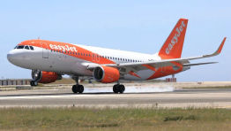 EasyJet A320  taxis along a runway.