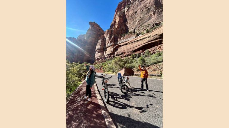Biking on Zion National Park's main road gets travelers up close to incredible rock formations.
