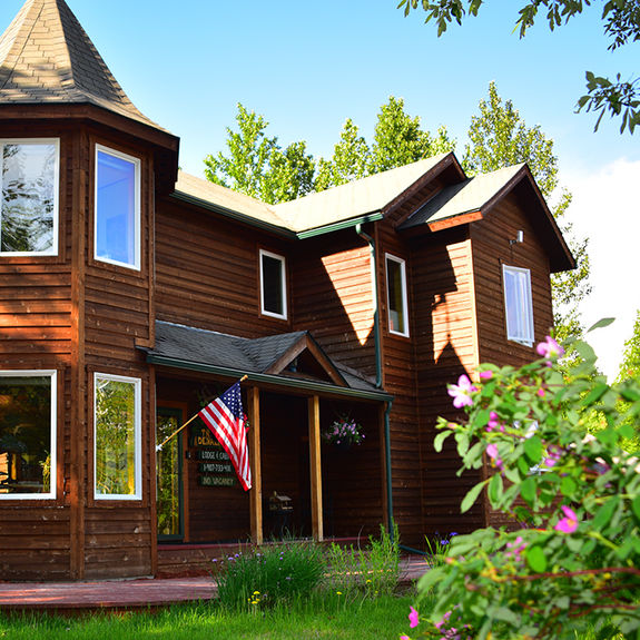 Talkeetna Denali View Lodge & Cabins is situated on a bluff above a surrounding forest, for unobscured views of Denali.