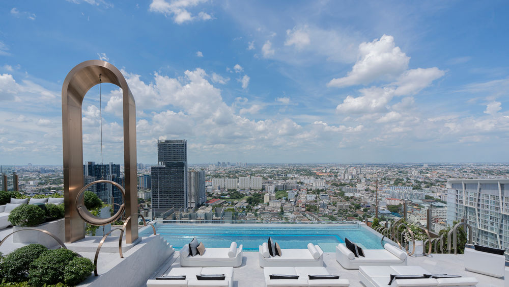 The hotel’s pool deck offers a giant swing and epic city views.