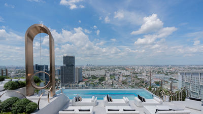 The hotel’s pool deck offers a giant swing and epic city views.