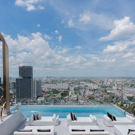 The hotel’s pool deck offers a giant swing and epic city views.