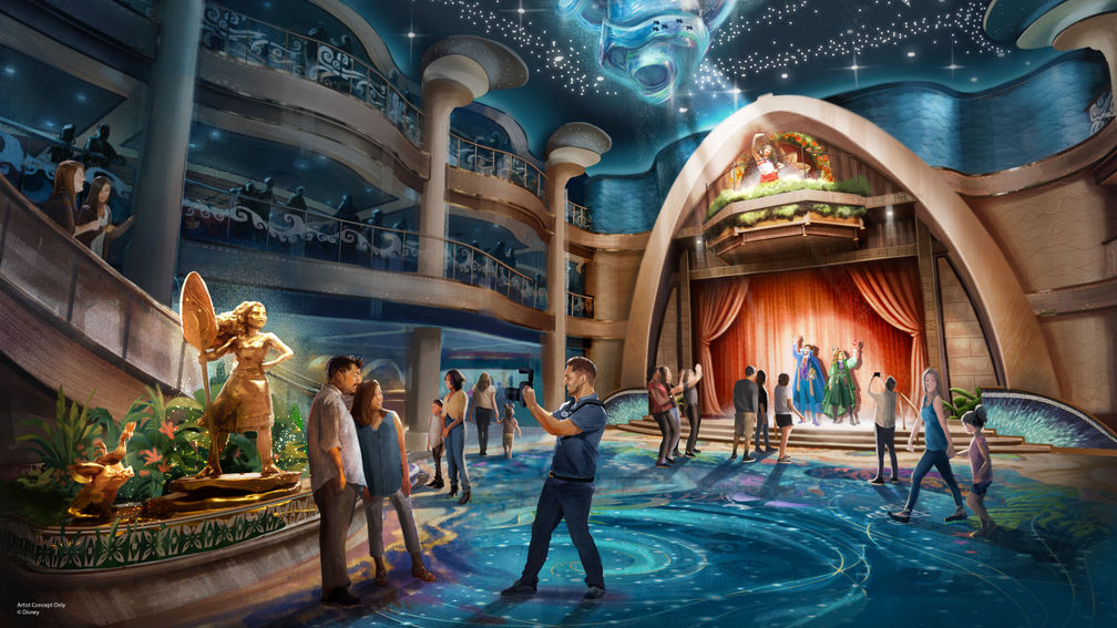 A grand theater lobby features a blue pool and illuminated stage.