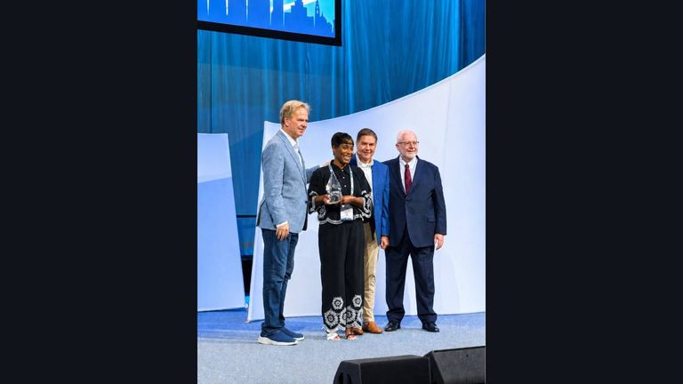 Baisley-Woodley accepting her award on stage on May 29