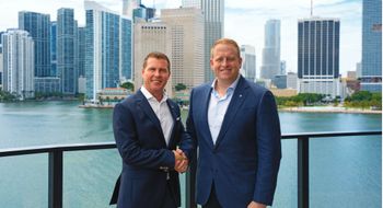 Sandals executive chairman Adam Stewart, left, with Royal Caribbean Group CEO Jason Liberty.