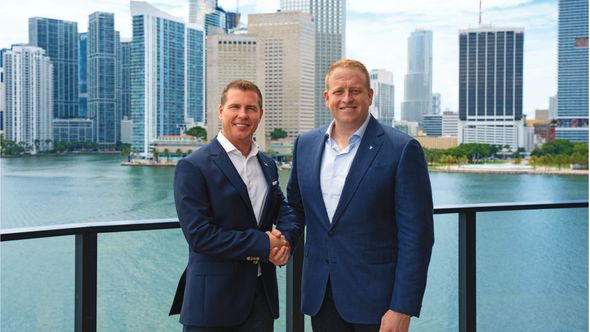 Sandals executive chairman Adam Stewart, left, with Royal Caribbean Group CEO Jason Liberty.