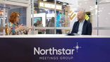 Julie Stow of Hello Cedar Rapids speaks at IMEX America.