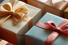 Colorful gift boxes wrapped with satin ribbons.