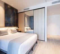 Skye Suites Green Square Room