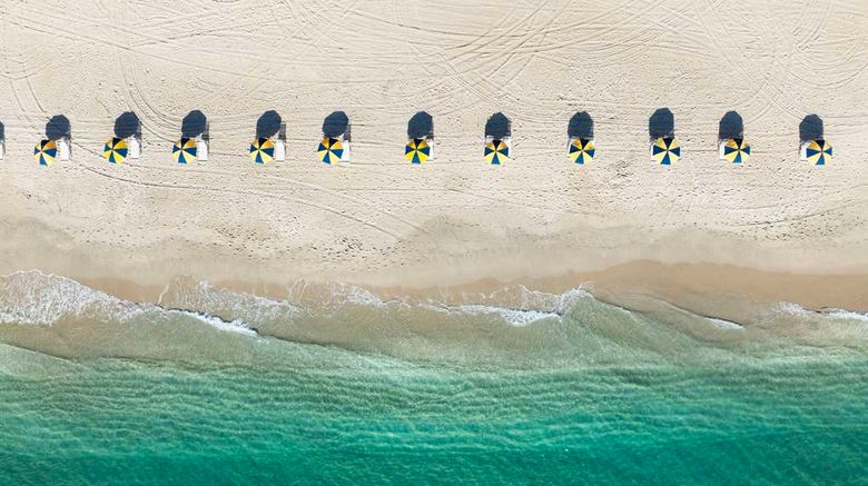 <b>The Singer Oceanfront Resort Beach</b>. Images powered by <a href="https://iceportal.shijigroup.com/" title="IcePortal" target="_blank">IcePortal</a>.