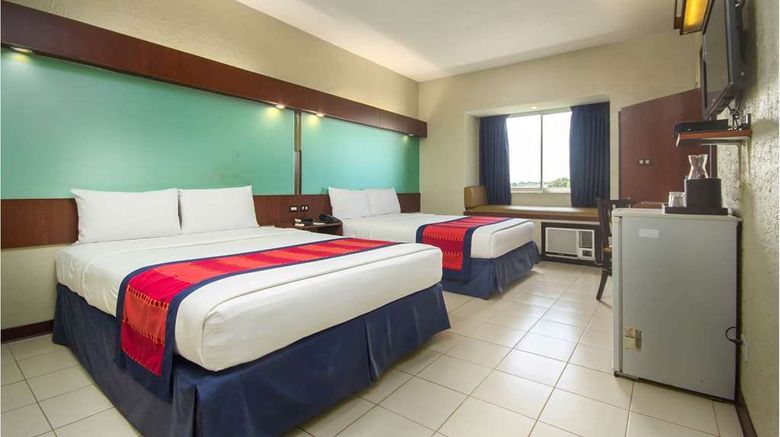 <b>Microtel by Wyndham Eagle Ridge Room</b>. Images powered by <a href="https://iceportal.shijigroup.com/" title="IcePortal" target="_blank">IcePortal</a>.