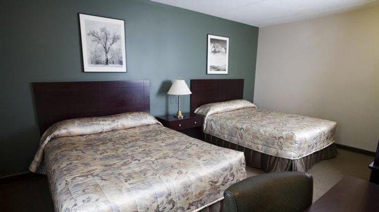 Heritage Inn & Suites Room