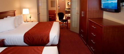 Merit Hotel & Suites Room
