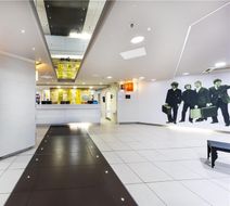 Hampton by Hilton/John Lennon Airport Lobby
