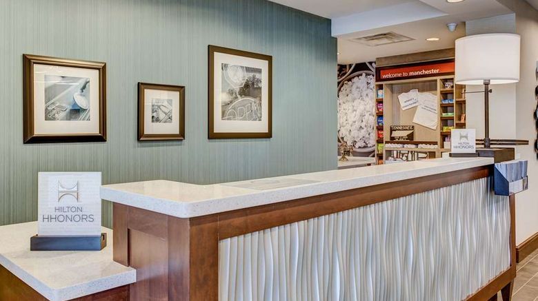 <b>Hampton Inn & Suites Manchester Lobby</b>. Images powered by <a href="https://iceportal.shijigroup.com/" title="IcePortal" target="_blank">IcePortal</a>.