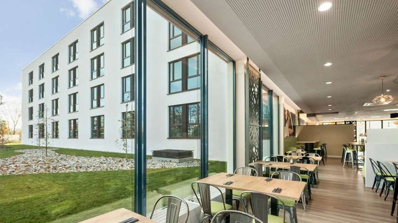 <b>Super 8 Munich City North Restaurant</b>. Images powered by <a href="https://iceportal.shijigroup.com/" title="IcePortal" target="_blank">IcePortal</a>.