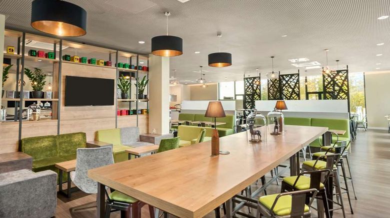 <b>Super 8 Munich City North Restaurant</b>. Images powered by <a href="https://iceportal.shijigroup.com/" title="IcePortal" target="_blank">IcePortal</a>.