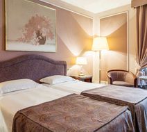 Adi Doria Grand Hotel Room