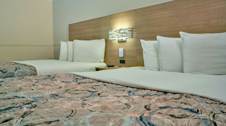 Family Garden Inn & Suites Room