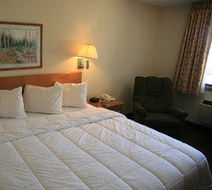 New Victorian Inn & Suites Room