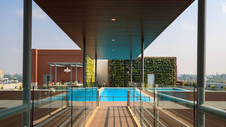 <b>Renaissance Bengaluru Race Course Hotel Pool</b>. Images powered by <a href=https://www.travelagewest.com/Hotels/Bengaluru-India/