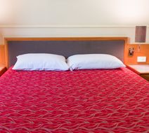 The Q Motel Room