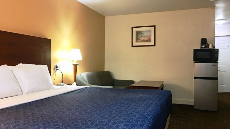 Passport Inn & Suites Room