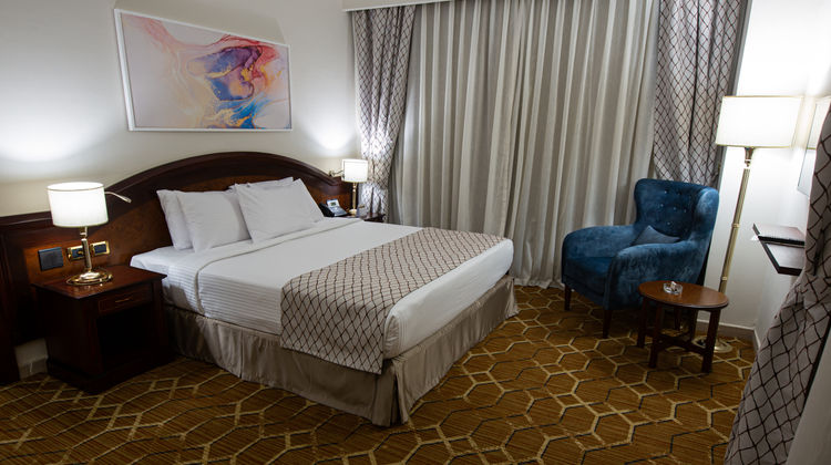 Triumph Plaza Hotel Room