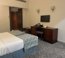 Triumph Plaza Hotel Room