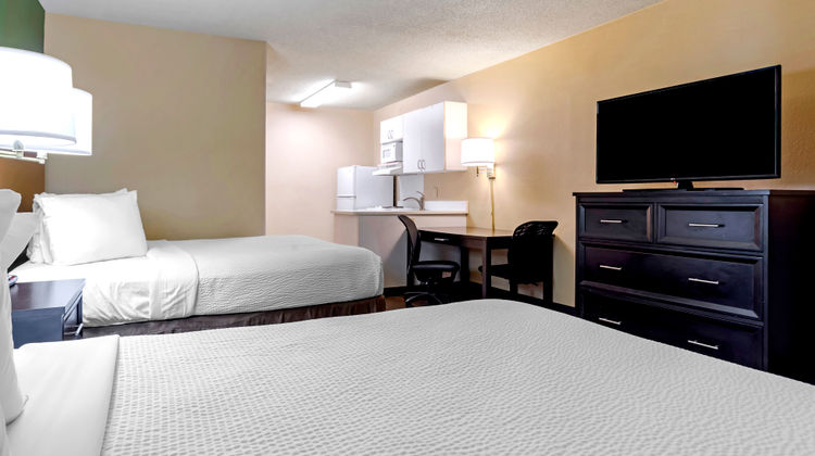 Home 1 Suites Extended Stay Room
