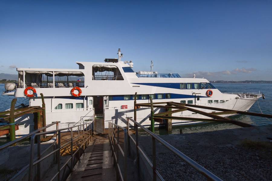 Fast ferry landing at the pier waiting for the foot passengers