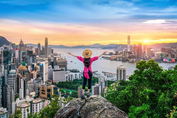 Tourist standing on viewpoint in Hong Kong.