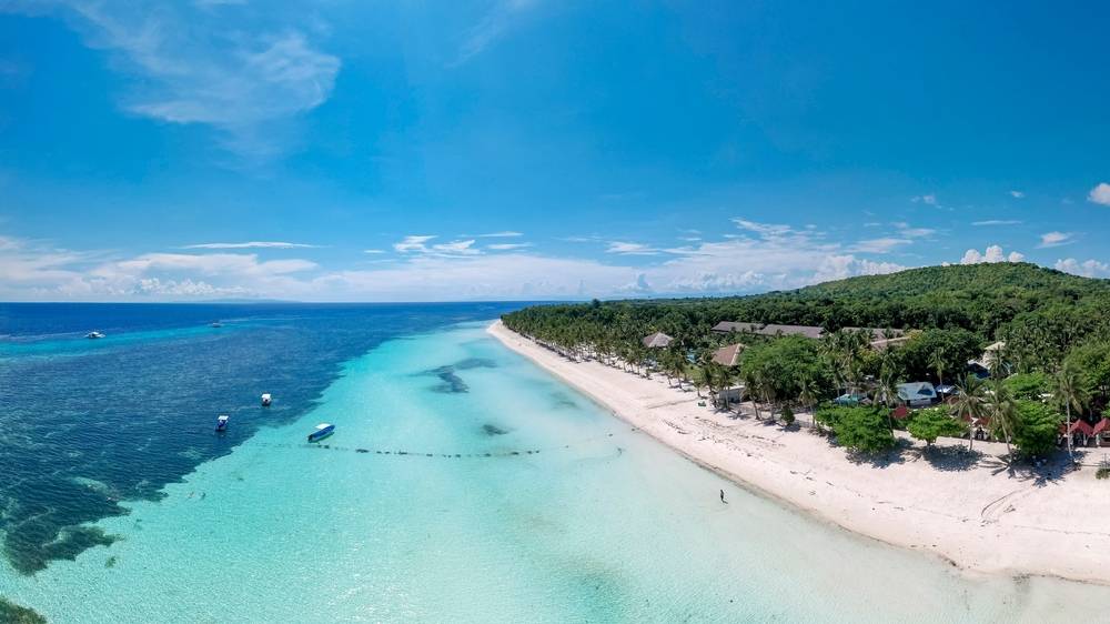 Panoramic view of the coastline of Panglao island in Bohol. The beautiful white beach of Dumaluan.